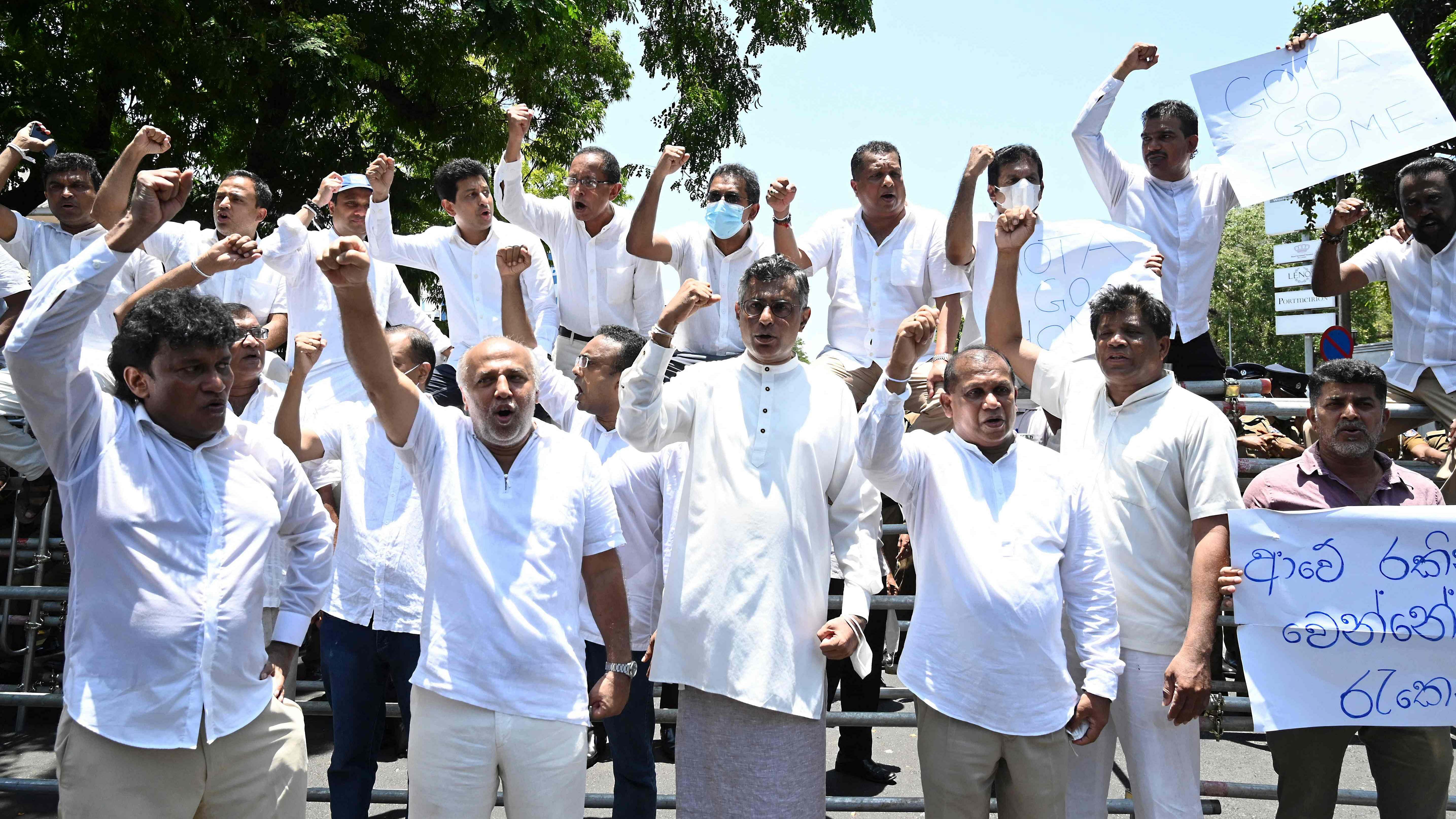 Sri Lanka's main opposition parliament members shout slogans as they protest in Colombo. Credit: AFP Photo