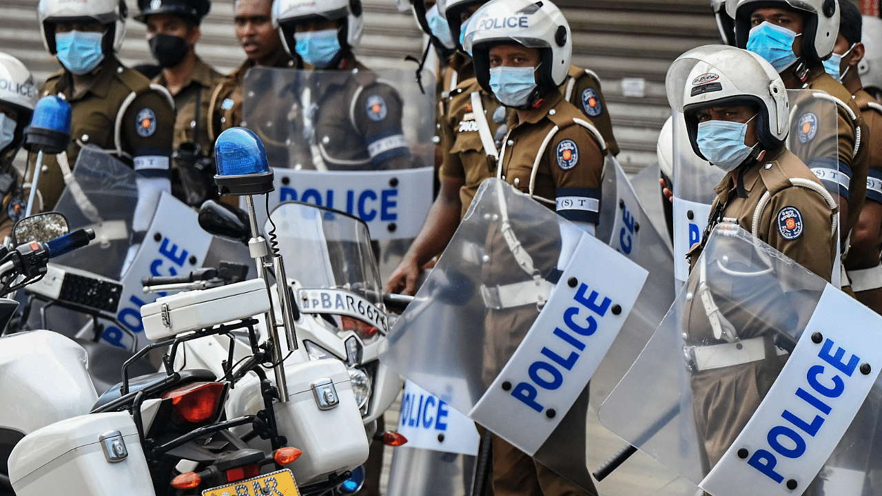 Police prepare to patrol the streets after authorities imposed a nationwide weekend curfew to contain protests over a worsening economic crisis, in Colombo. Credit: AFP Photo
