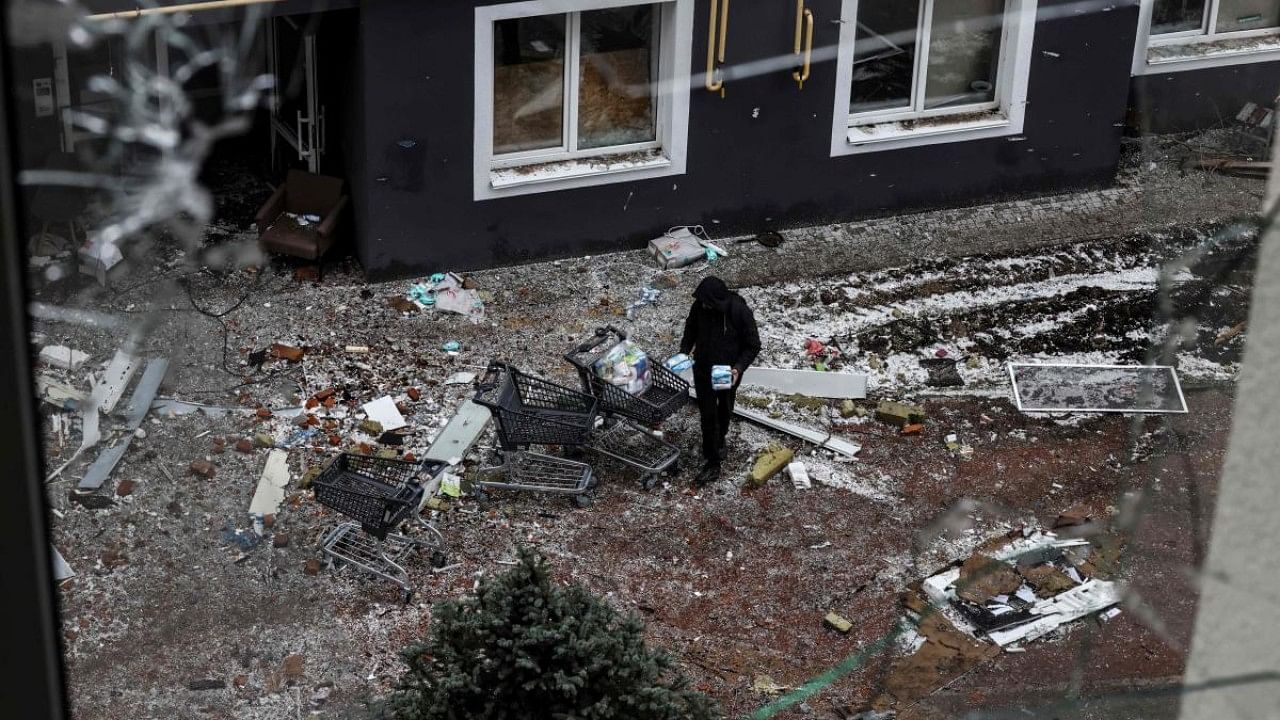 A man looking for food is pictured in Bucha, northwest of Kyiv. Credit: APF Photo