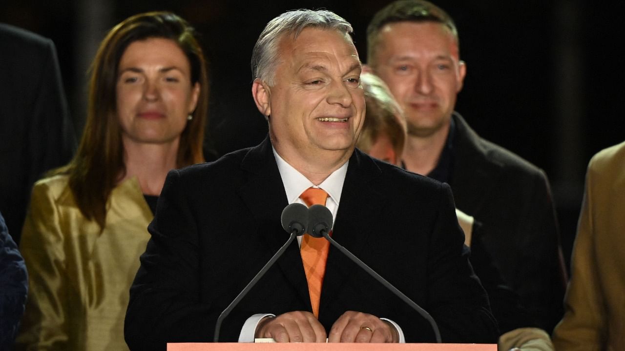 Hungarian Prime Minister Viktor Orban celebrates on stage with members of the Fidesz party. Credit: AFP Photo