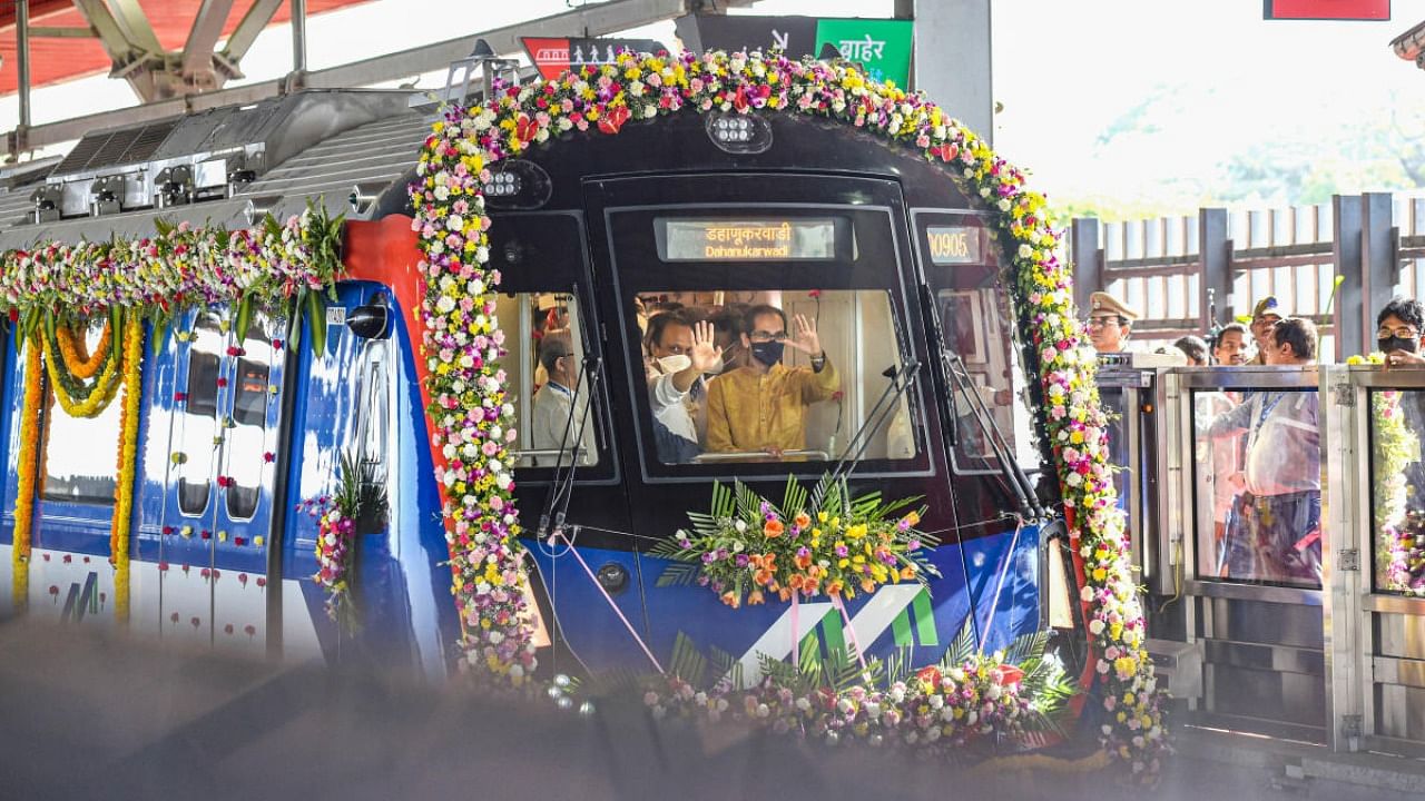 Maharashtra Chief Minister Uddhav Thackeray with Deputy Chief Minister Ajit Pawar inside a metro train, during the inauguration of Mumbai Metro's 7 and 2A lines, in Mumbai, Saturday, April 2, 2022. Credit: PTI Photo