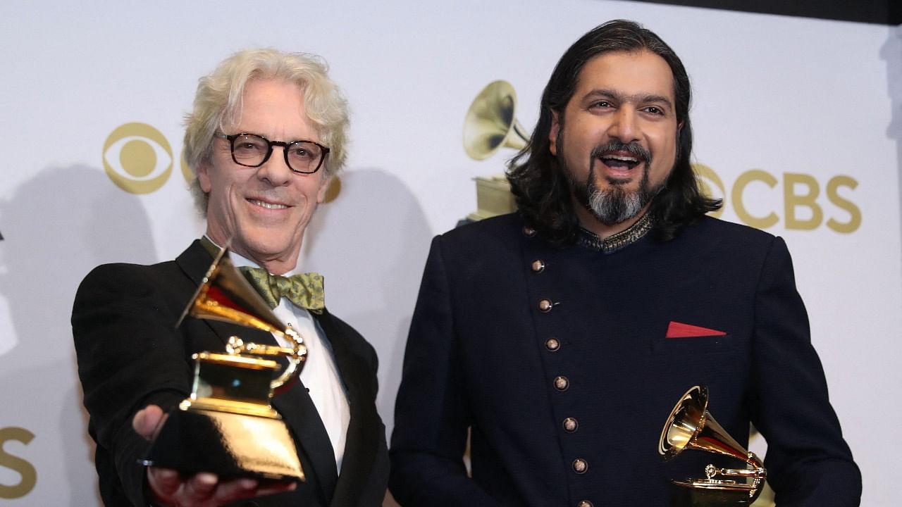 Ricky Kej (R) and The Police drummer Steve Copeland pose with their Grammys. Credit: Reuters Photo