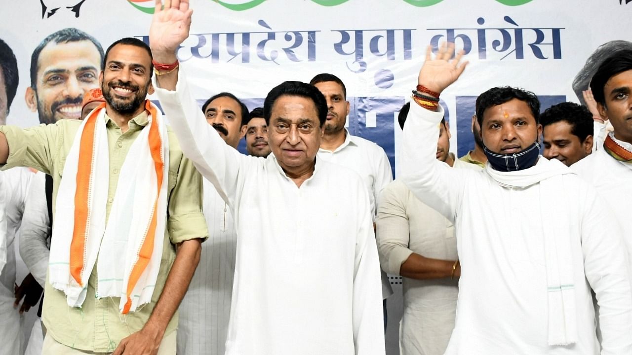Congress senior leader Kamal Nath with party members during state party youth meeting in Bhopal. Credit: IANS Photo