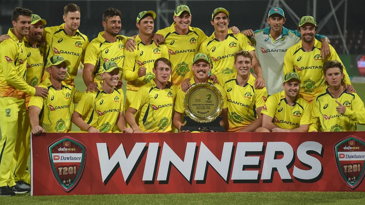 Australia's players pose with the trophy after winning the Twenty20 international cricket match against Pakistan. Credit: AFP Photo