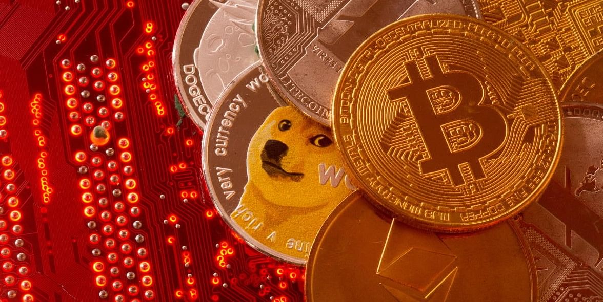 Representations of cryptocurrencies Bitcoin, Ethereum, DogeCoin, Ripple, Litecoin are placed on PC motherboard in this illustration taken. Credit: REUTERS FILE PHOTO