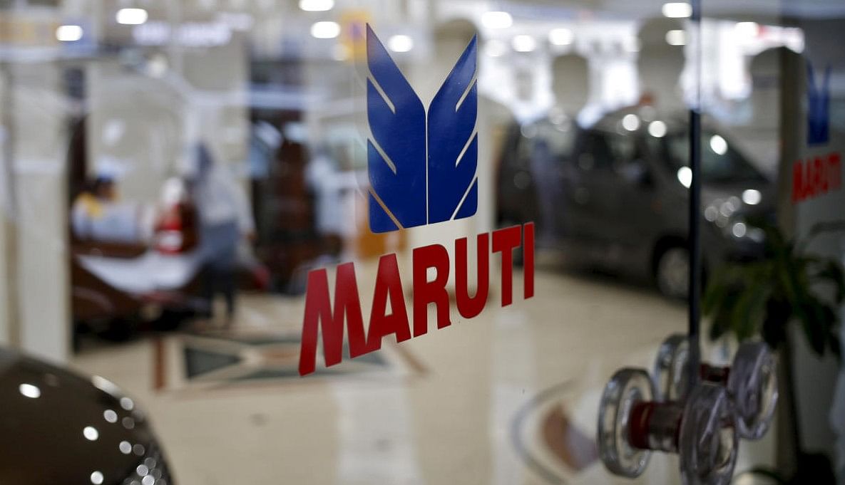The logo of Maruti Suzuki India Limited is seen on a glass door at a showroom in New Delhi. Credit: REUTERS FILE PHOTO