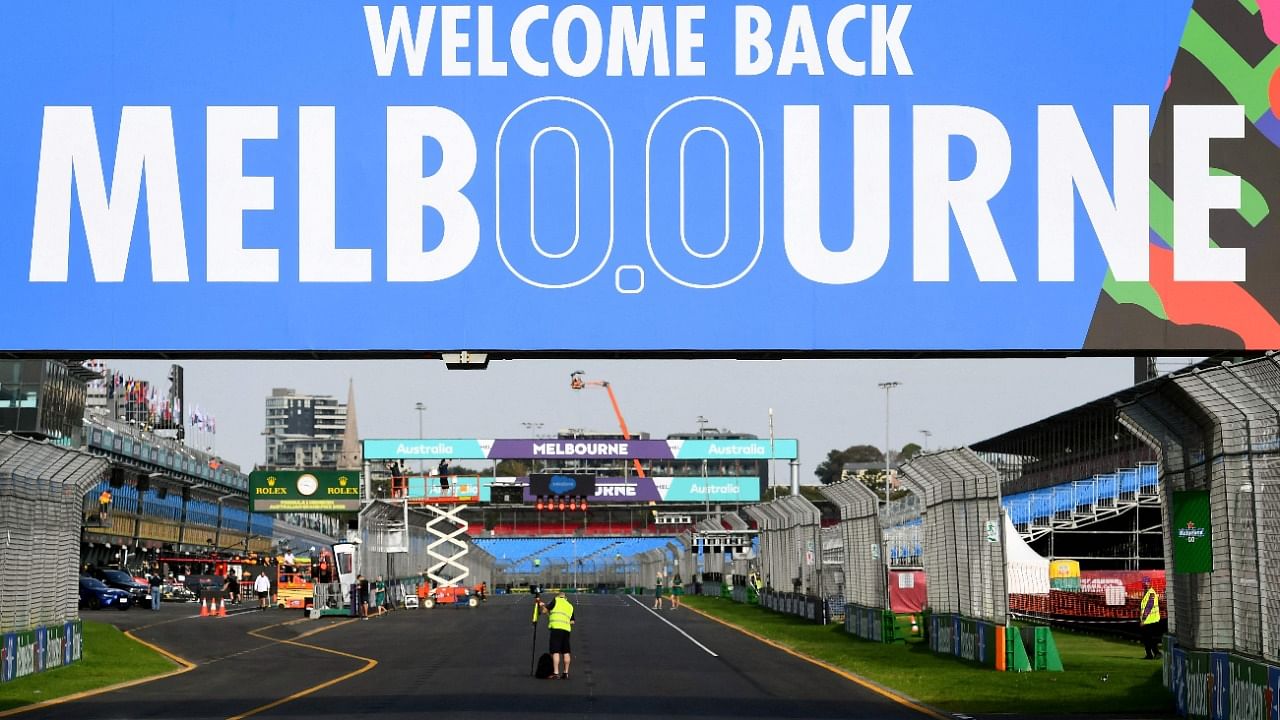 A welcome back Melbourne sign sits above pit straight at the Albert Park Circuit in Melbourne on April 6, 2022, ahead of the 2022 Formula One Australian Grand Prix. Credit: AFP Photo