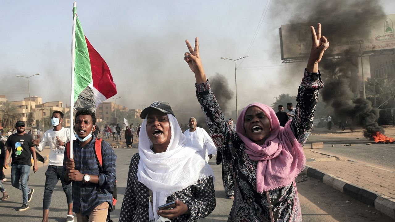 Sudanese protesters take part in a rally against military rule on the anniversary of previous popular uprisings, in Khartoum. Credit: AP Photo