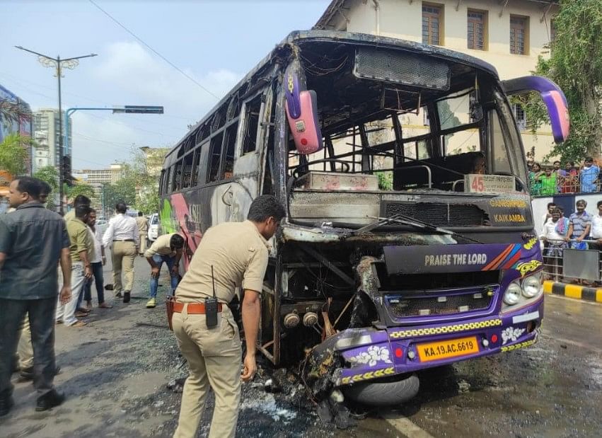 Private bus hits two-wheeler, catches fire. Credit: DH Photo/Irshad Mahammad