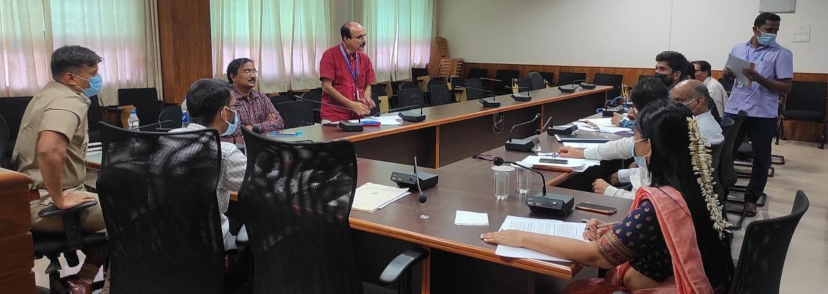 Deputy Commissioner M Kurma Rao chairs a meeting on road safety at his office in Manipal.