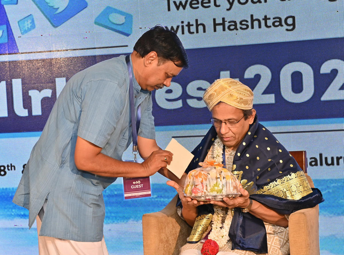 Shatavadhani R Ganesh is felicitated by Prasanna of Mythic Society, during the inaugural session of the fourth edition of Mangaluru Lit Fest at Hotel Ocean Pearl on Friday. DH Photo