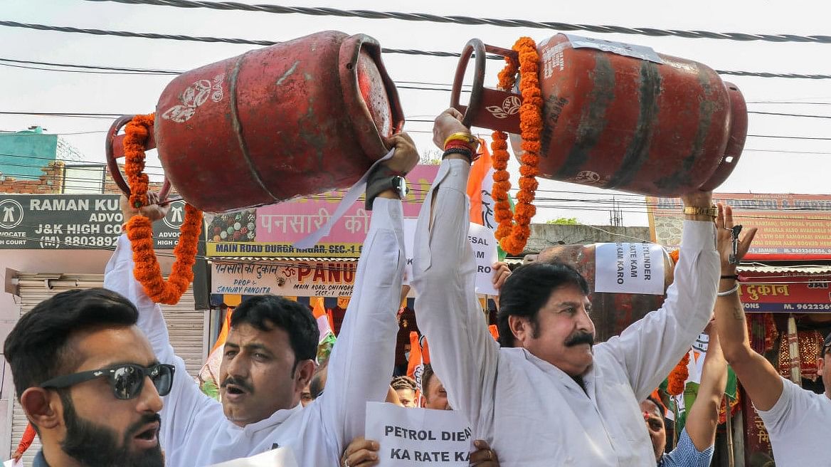Congress leaders protest over the hike in prices of petrol, diesel and LPG cylinders in Jammu. Credit: PTI