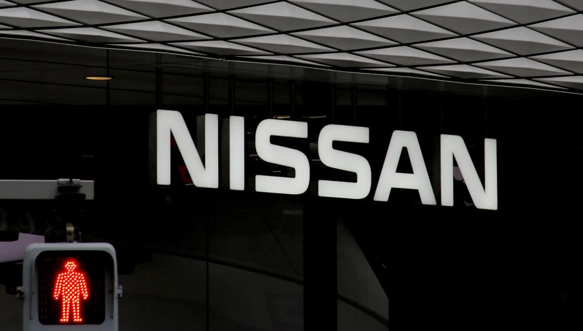The logo of Nissan Motor Co. is seen at its show room behind a traffic sign in Tokyo. Credit: REUTERS FILE PHOTO