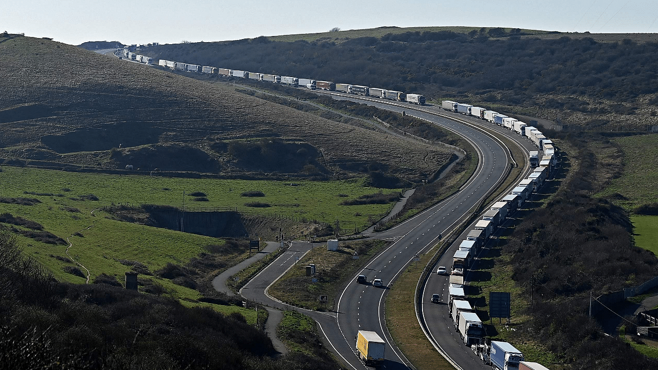Freight lorries and HGVs (heavy goods vehicles) queue on the A20 road towards the Port of Dover on the south-east coast of England. Credit: AFP File Photo