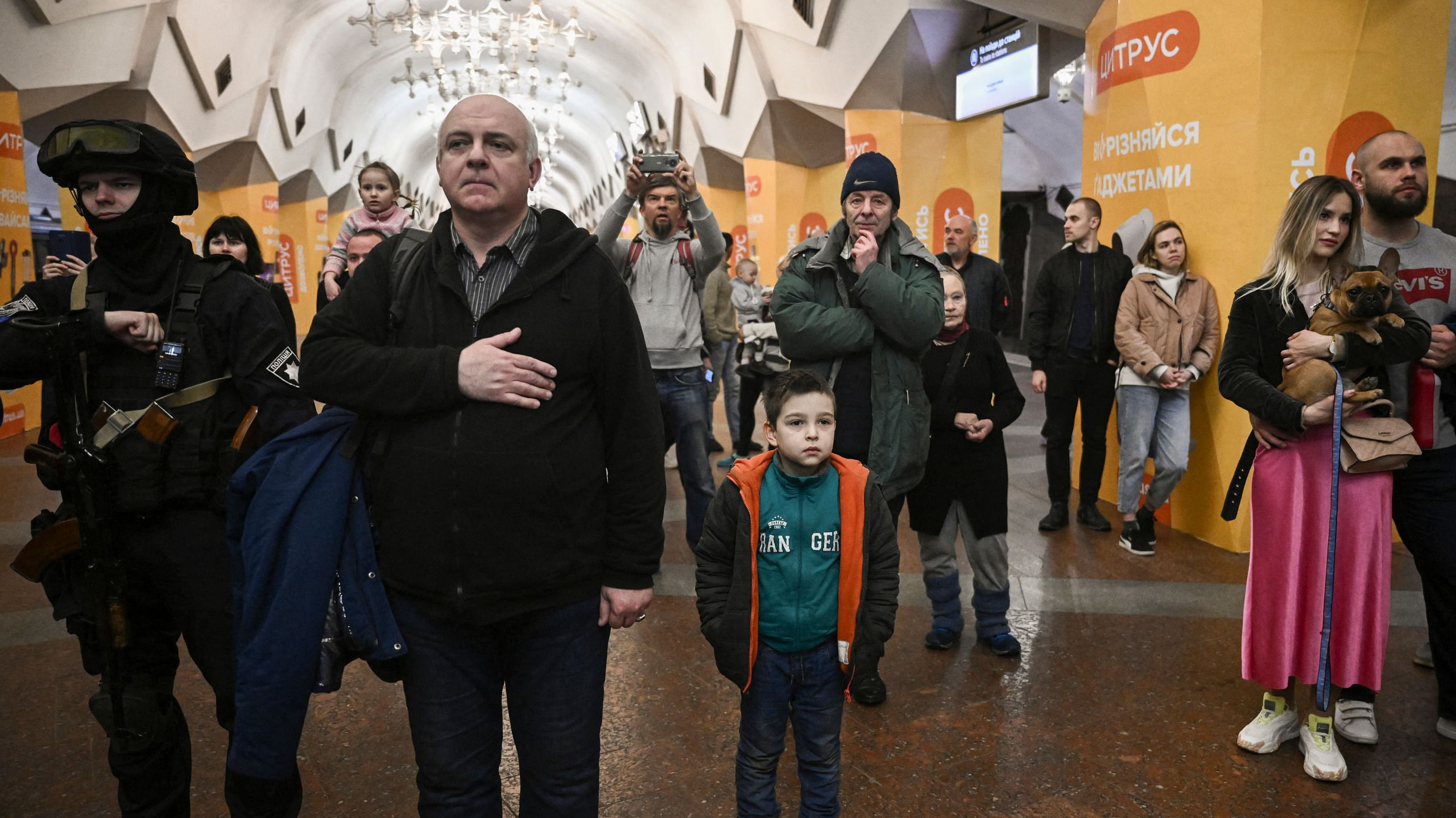 A missile strike killed 52 people at a train station in eastern Ukraine where civilians had gathered to flee a feared Russian offensive. People living in a metro station used as a bomb shelter listen to musicians playing for them in Kharkiv. Credit: AFP Photo