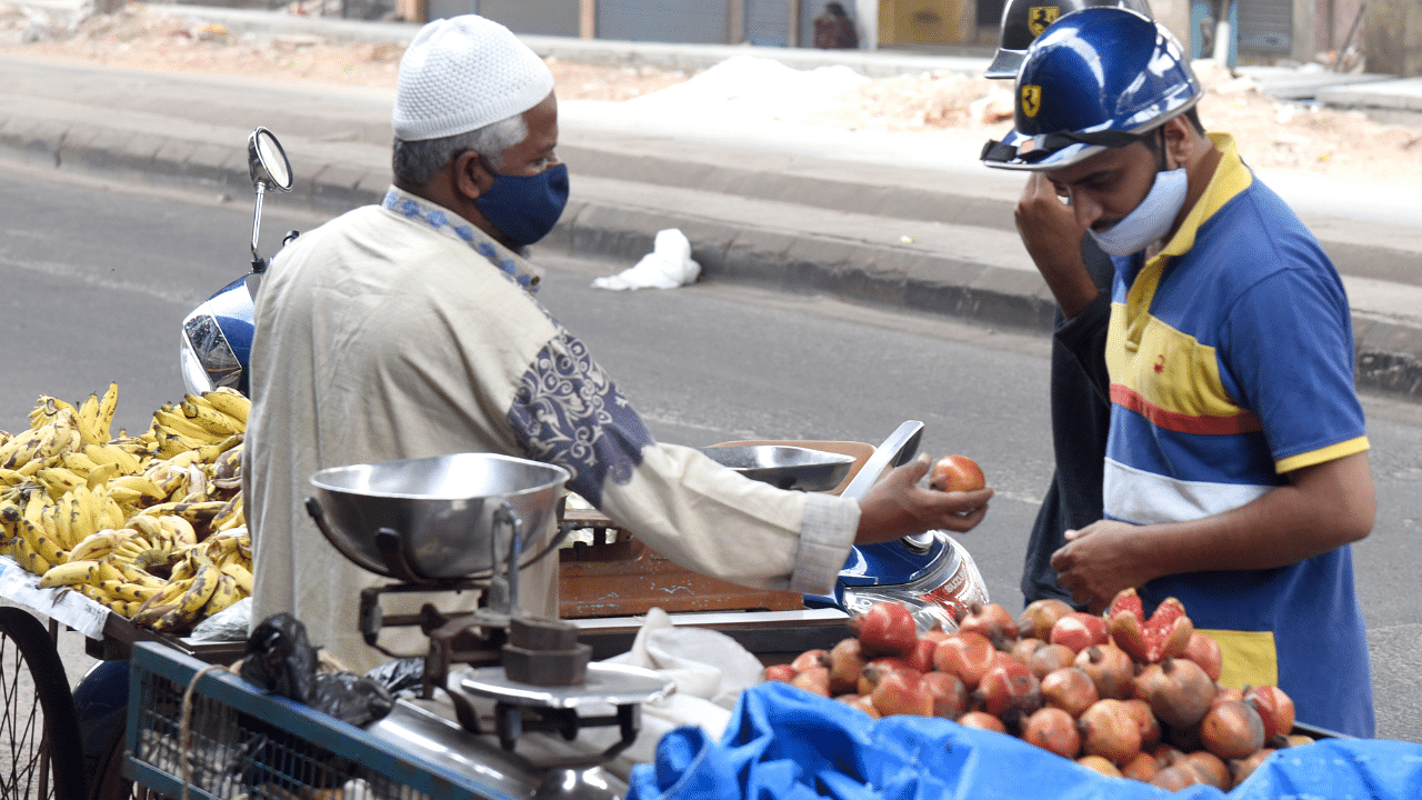 Vendors sale vegetables, fruits door to door in carts during government permitted to sale. Credit: DH Photo