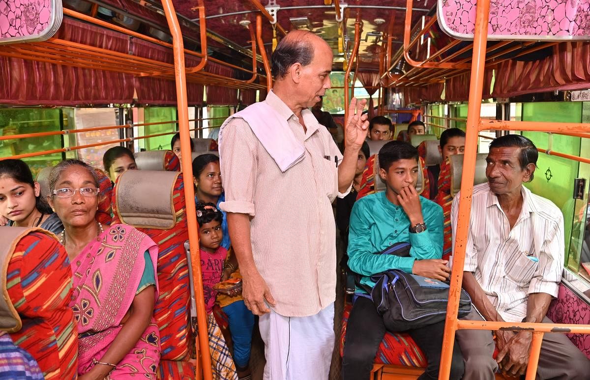 Farmer-cum-owner of Sai Ganesh bus K M Nagaraja Bhat interacts with his loyal bus passengers in Sulyapadavu in Puttur taluk.