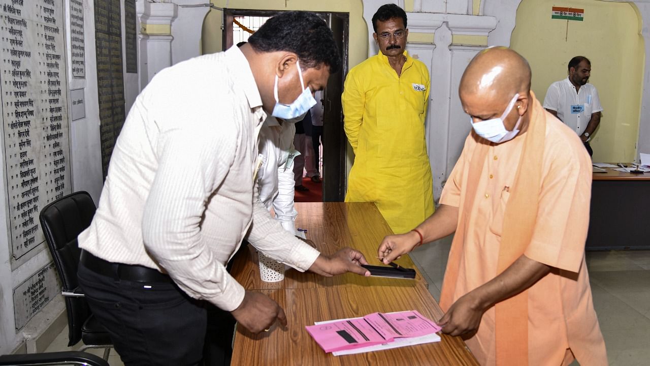 UP Chief Minister Yogi Adityanath casts his vote for MLC elections, in Gorakhpur. Credit: PTI Photo