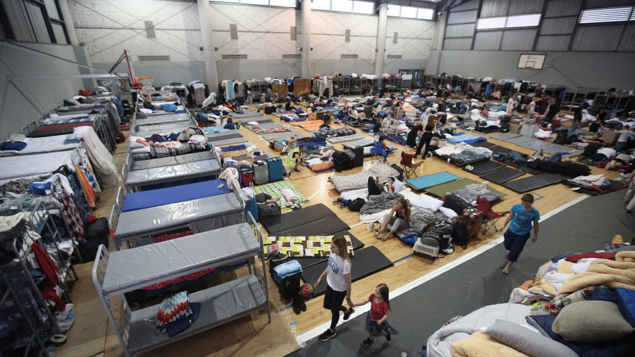 Ukrainians wait to cross the US border, in Tijuana. Credit: Reuters Photo