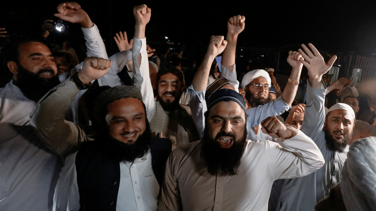 Pakistan Democratic Movement supporters celebrate after former PM Khan lost a confidence vote, in Islamabad. Credit: Reuters Photo