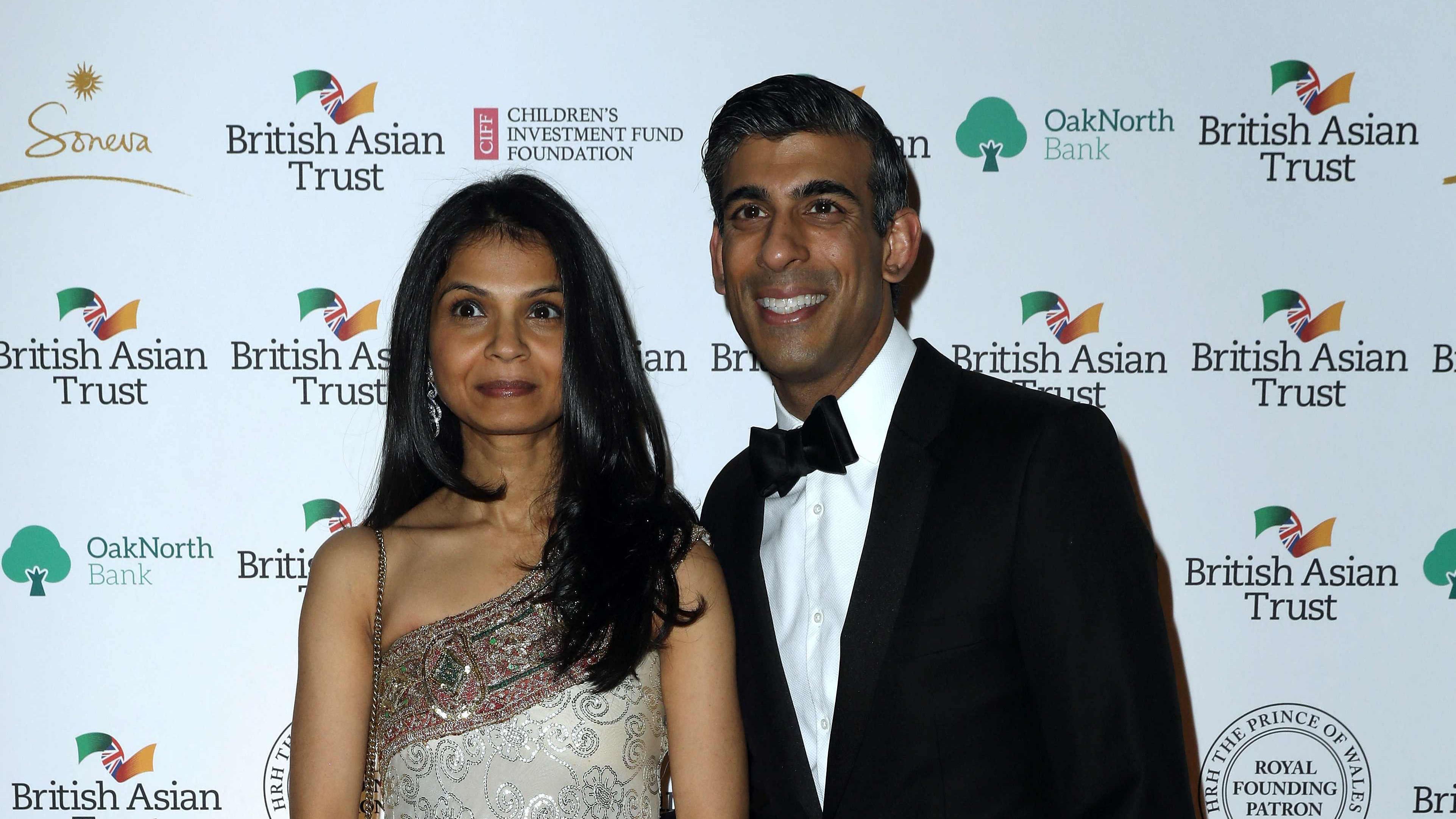 Britain's Chancellor of the Exchequer Rishi Sunak (R) poses with his wife Akshata Murty during a reception to celebrate the British Asian Trust at The British Museum in London. Credit: AFP Photo