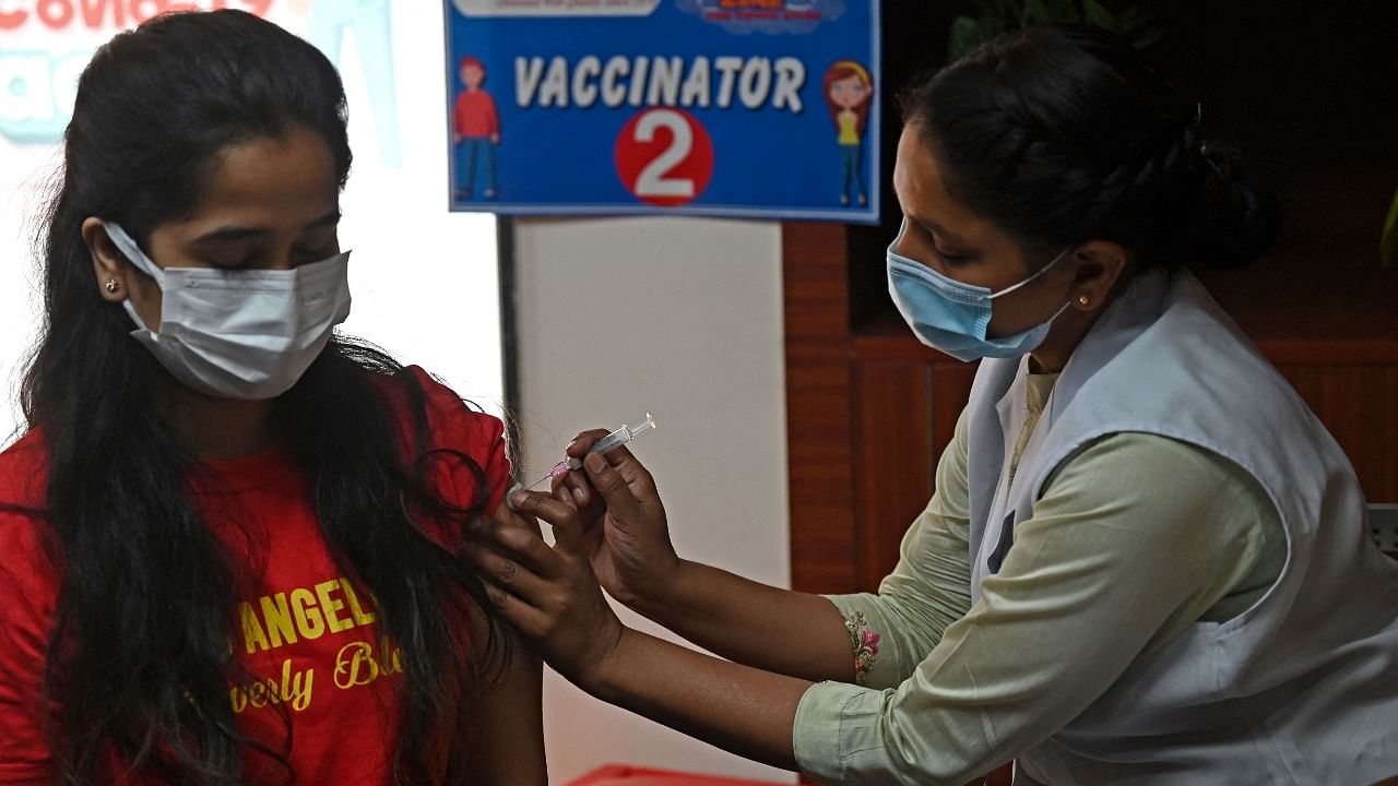 India on Sunday began administering precaution dose of Covid-19 vaccines to all aged above 18 years at private vaccination centres. Credit: AFP Photo