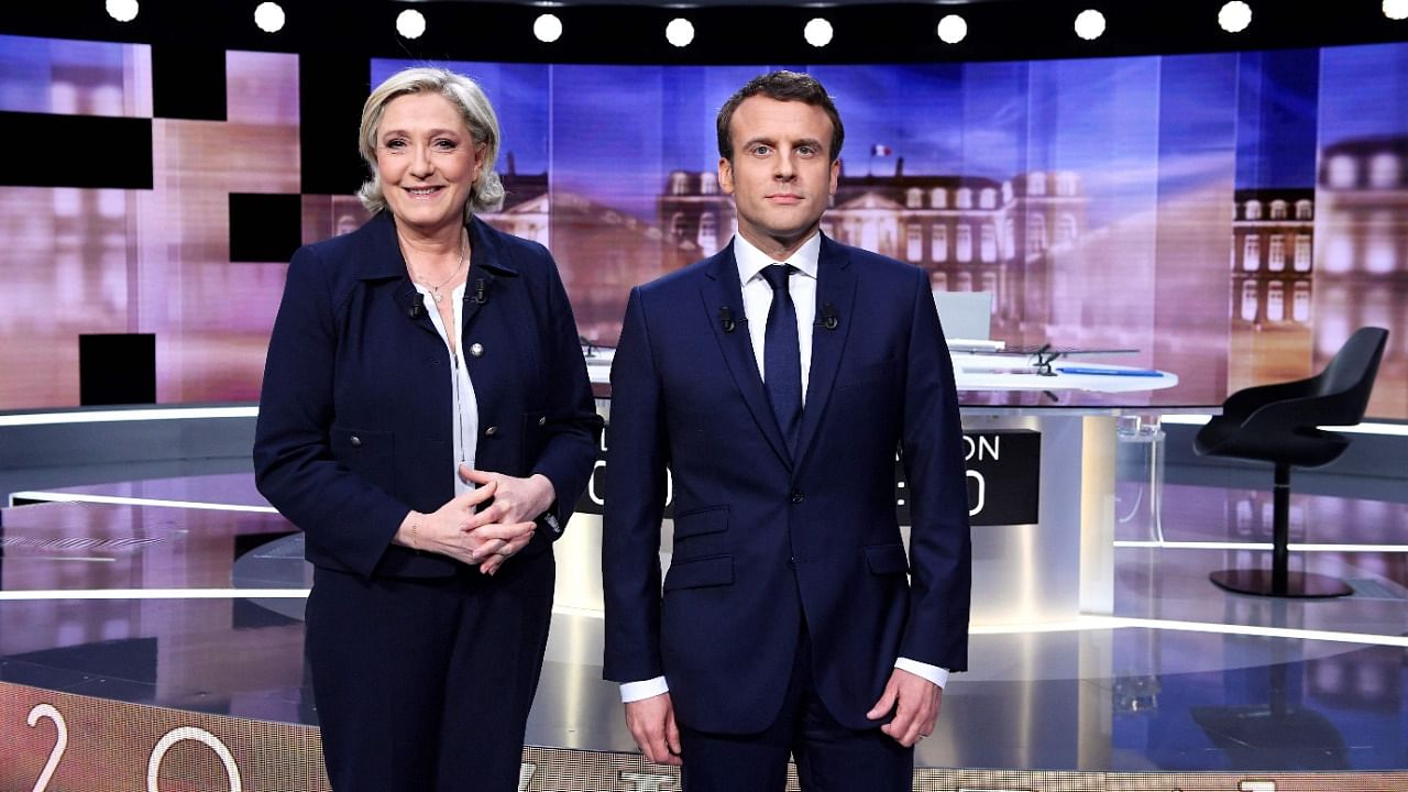 Marine Le Pen (L) and French President Emmanuel Macron. Credit: AFP Photo