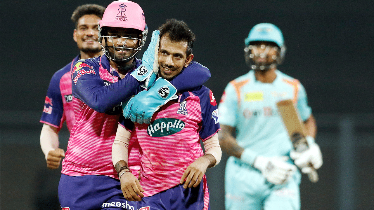 Yuzvendra Chahal of Rajasthan Royals with teammate Sanju Samson after the wicket of Quinton de Kock of Lucknow Super Giants. Credit: PTI Photo