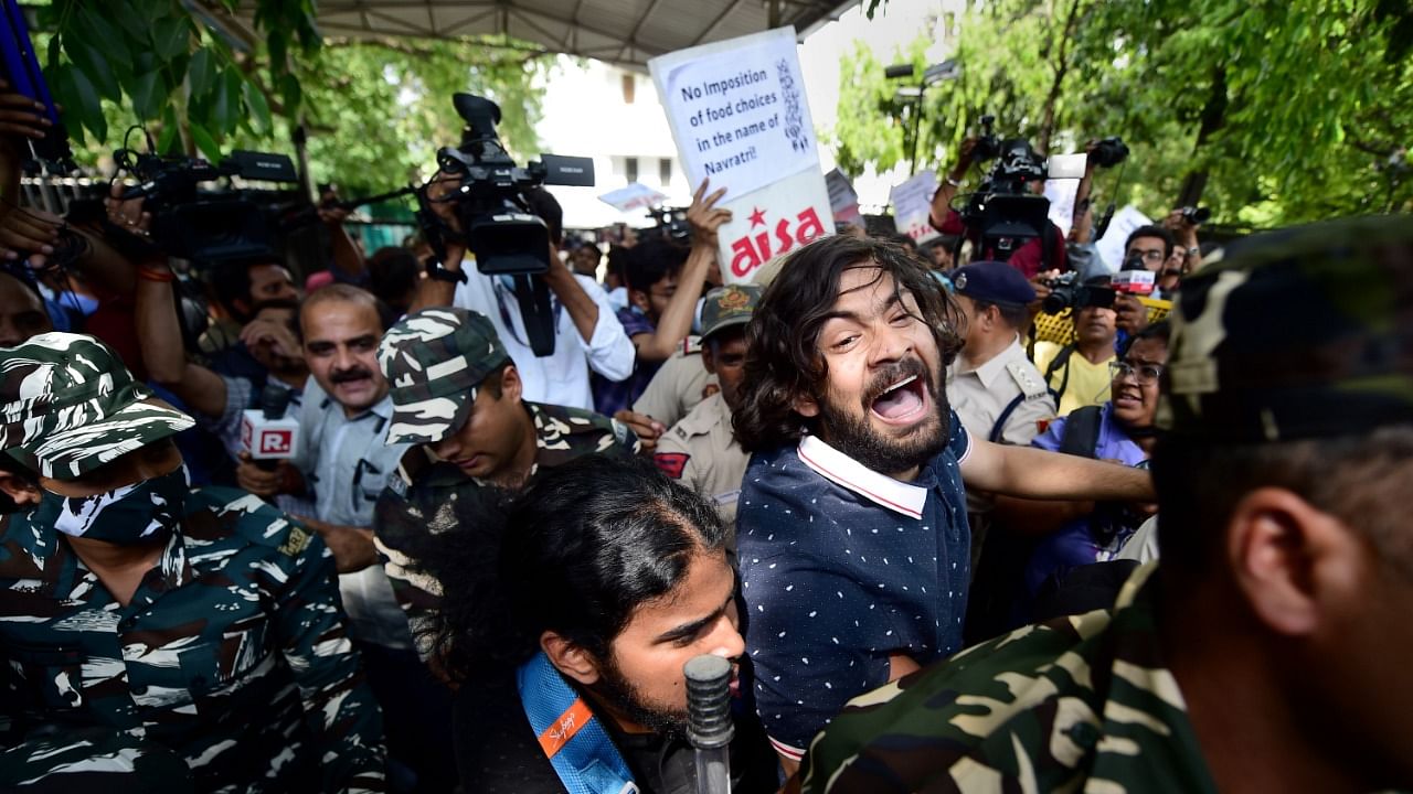 All India Students' Association (AISA) activists stage a protest, after after two groups of students clashed at JNU's Kaveri Hostel on Sunday, at PHQ in New Delhi. Credit: PTI Photo