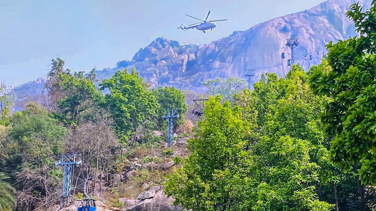 Rescue work under progress by Indian Air Force (IAF) and National Disaster  Response Force (NDRF) at Trikut Hill after a collision of cable cars, in Deogar district. Credit: PTI Photo