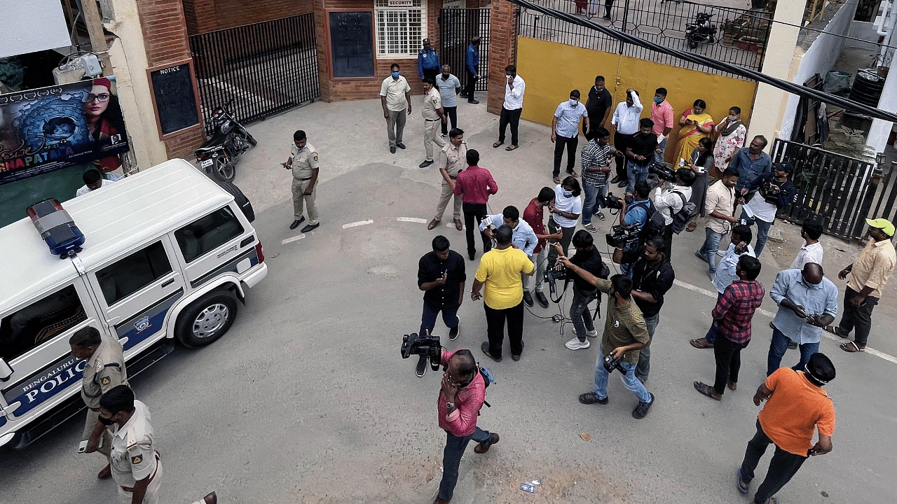 Police and parents outside a school, where the school authorities received a bomb hoax mail. Credit: PTI Photo