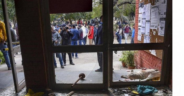 File Photo Shattered glass of doors are seen at the Sabarmati Hostel following the violence (on January 5, 2020), at the Jawaharlal Nehru University (JNU). Credit: PTI Photo