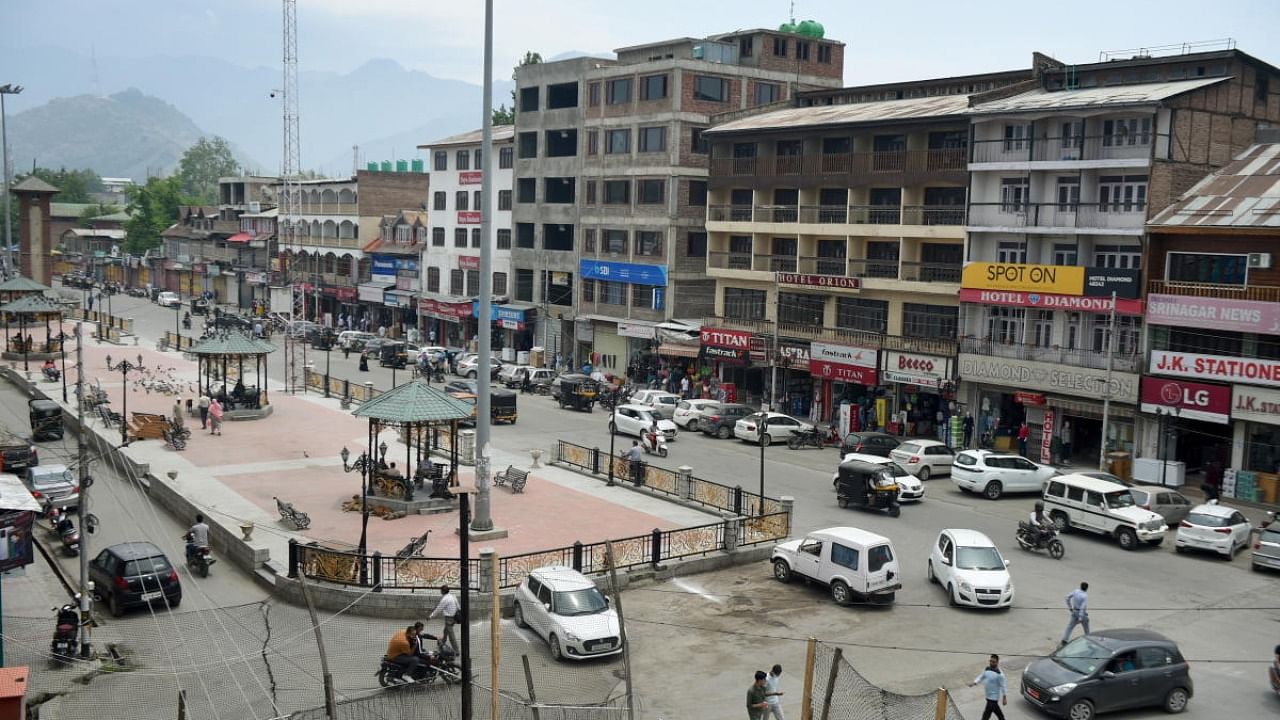 Vehicles ply on roads near Lal Chowk as markets reopened partially as per fresh COVID-19 lockdown guidelines with few relaxations in some public activities, in Srinagar, Monday, May 31, 2021. Credit: PTI Photo
