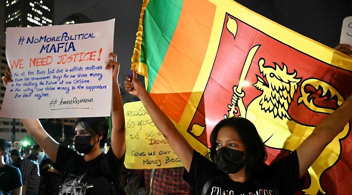 Protestors take part in a demonstration against the economic crisis at the entrance of the president's office in Colombo. Credit: AFP