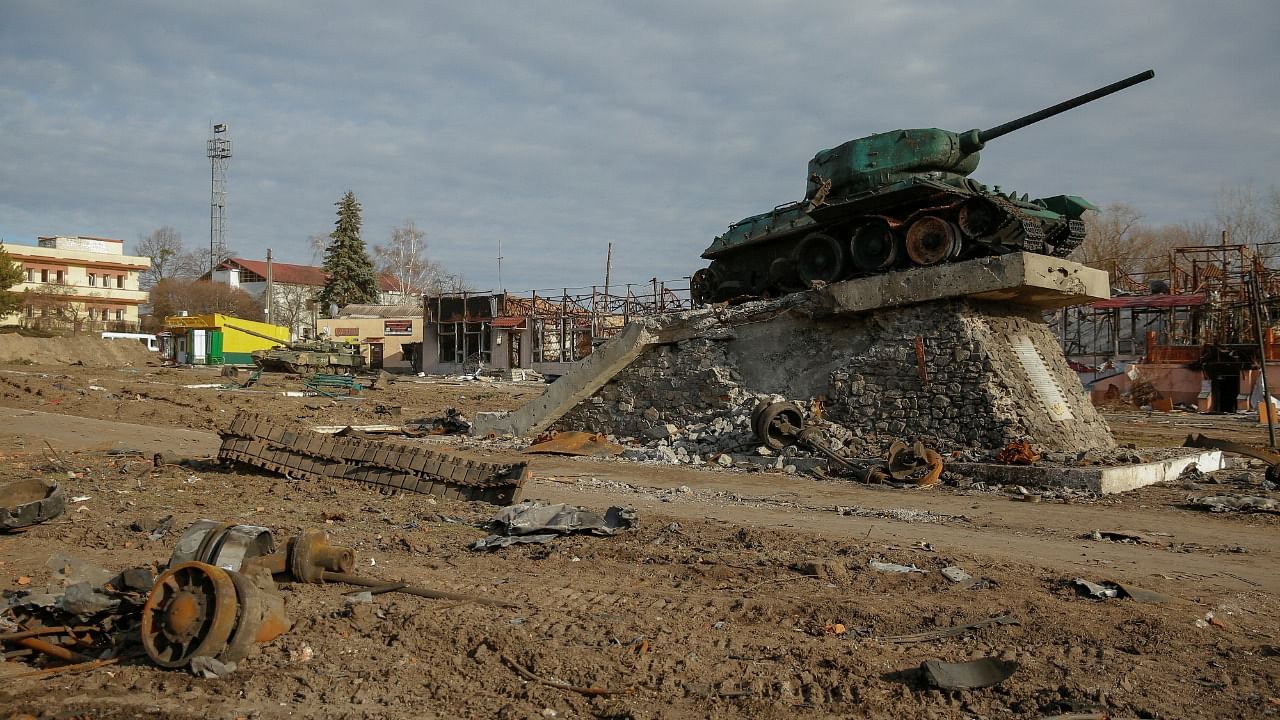 A monument to fallen WWII soldiers made of a Soviet tank T-34 is seen on a square damaged by shelling, as Russia’s attack on Ukraine continues, in the town of Trostianets. Credit: Reuters File Photo