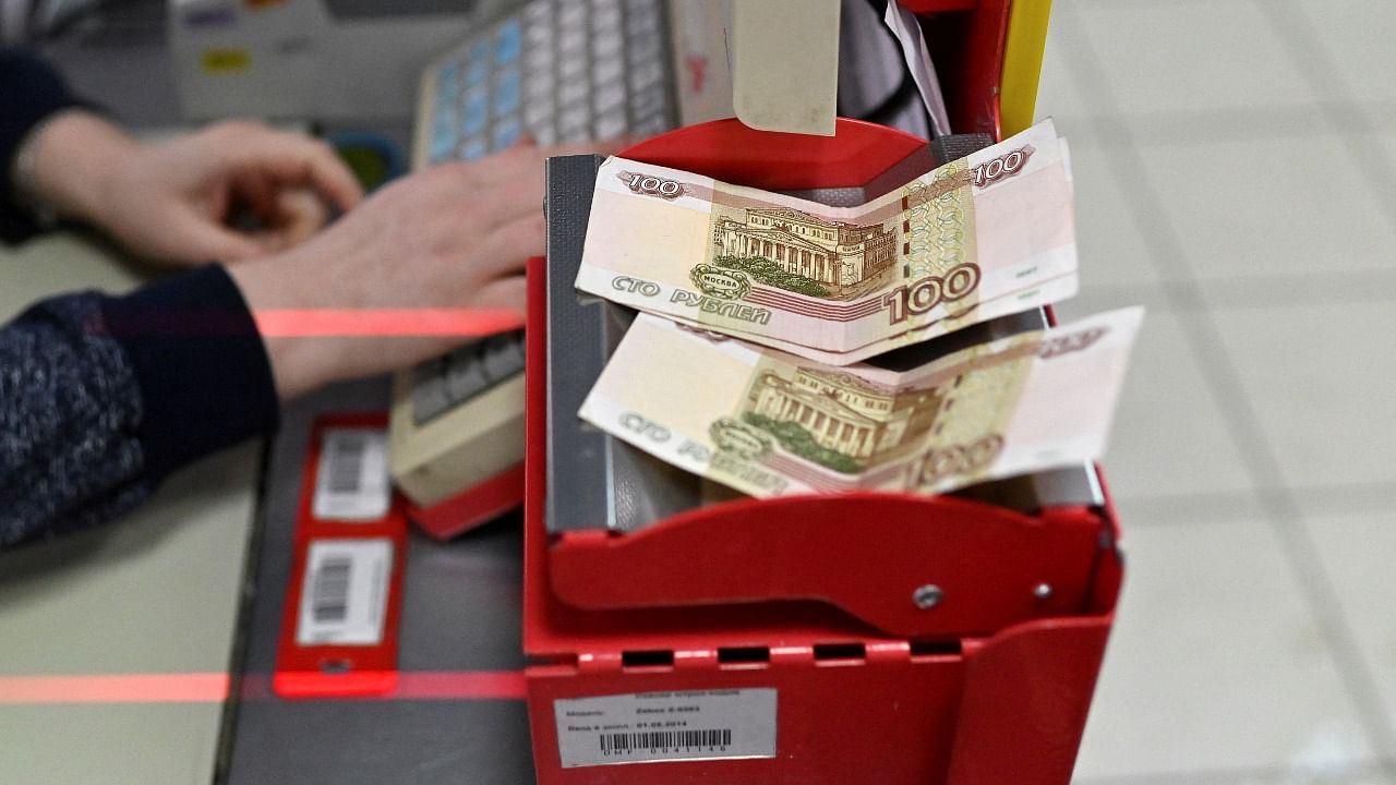 Russian 100-rouble banknotes are placed on a cashier's desk at a supermarket in the Siberian town of Tara in the Omsk region, Russia. Credit: Reuters File Photo