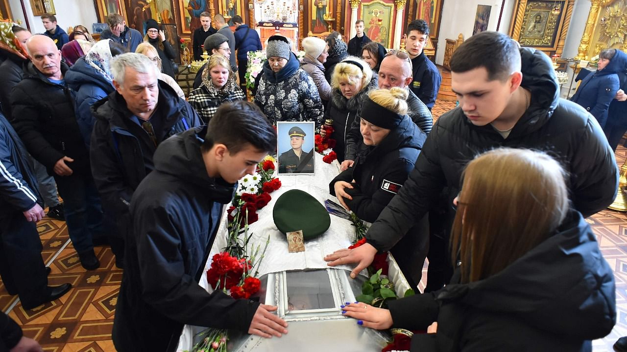Mourners attend the funeral service for 20 year-old Russian serviceman Nikita Avrov, at a church in in Luga some 150kms south of Saint Petersburg. Credit: AFP Photo