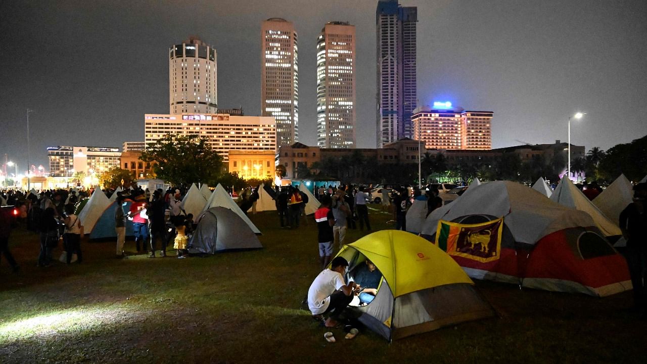 Protestors use temporary tents to rest during the day and night demonstration against the economic crisis at the entrance of the president's office in Colombo. Credit: AFP photo