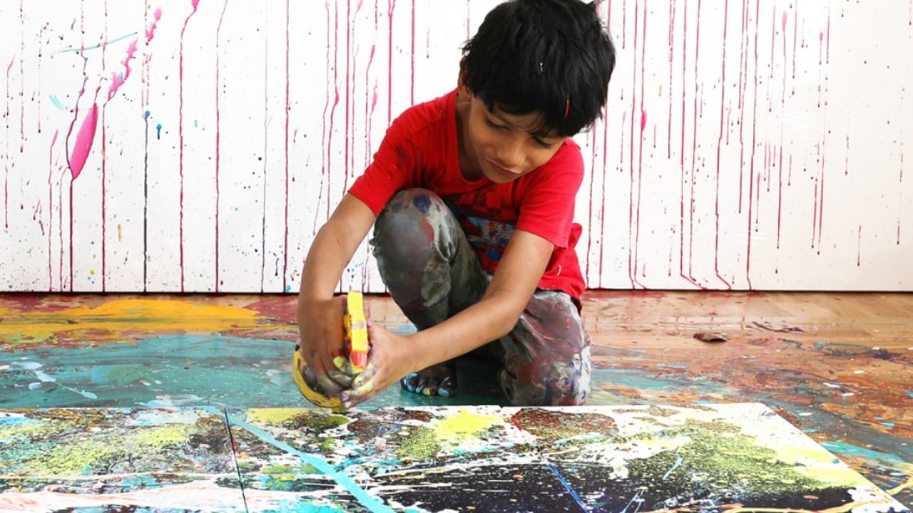 Advait Kolarkar, a seven-year-old child prodigy from Pune, is hard at work for the first solo exhibition in London of his vibrant paintings to be held at Gagliardi Gallery starting next month. Credit: Official Website/www.advaitkolarkar.com