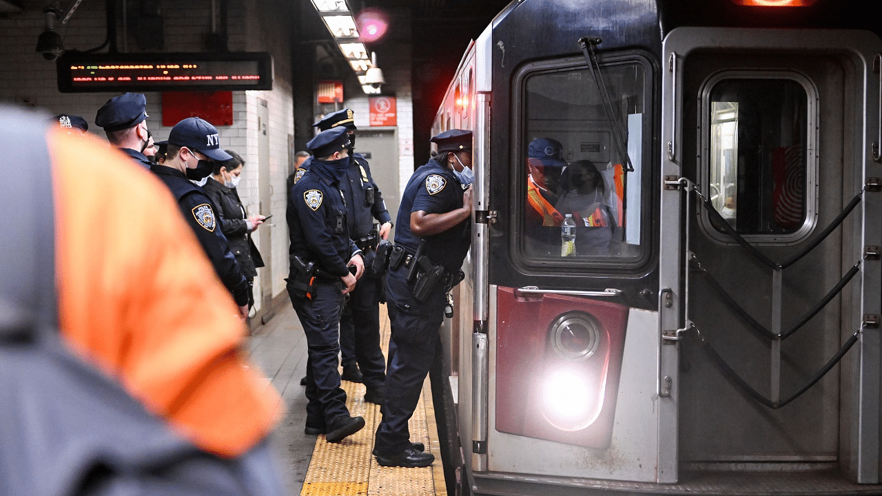 Members of the NYPD investigate an incident on an uptown 4 subway after an emergency brake was pulled near Union Square. Credit: AFP Photo