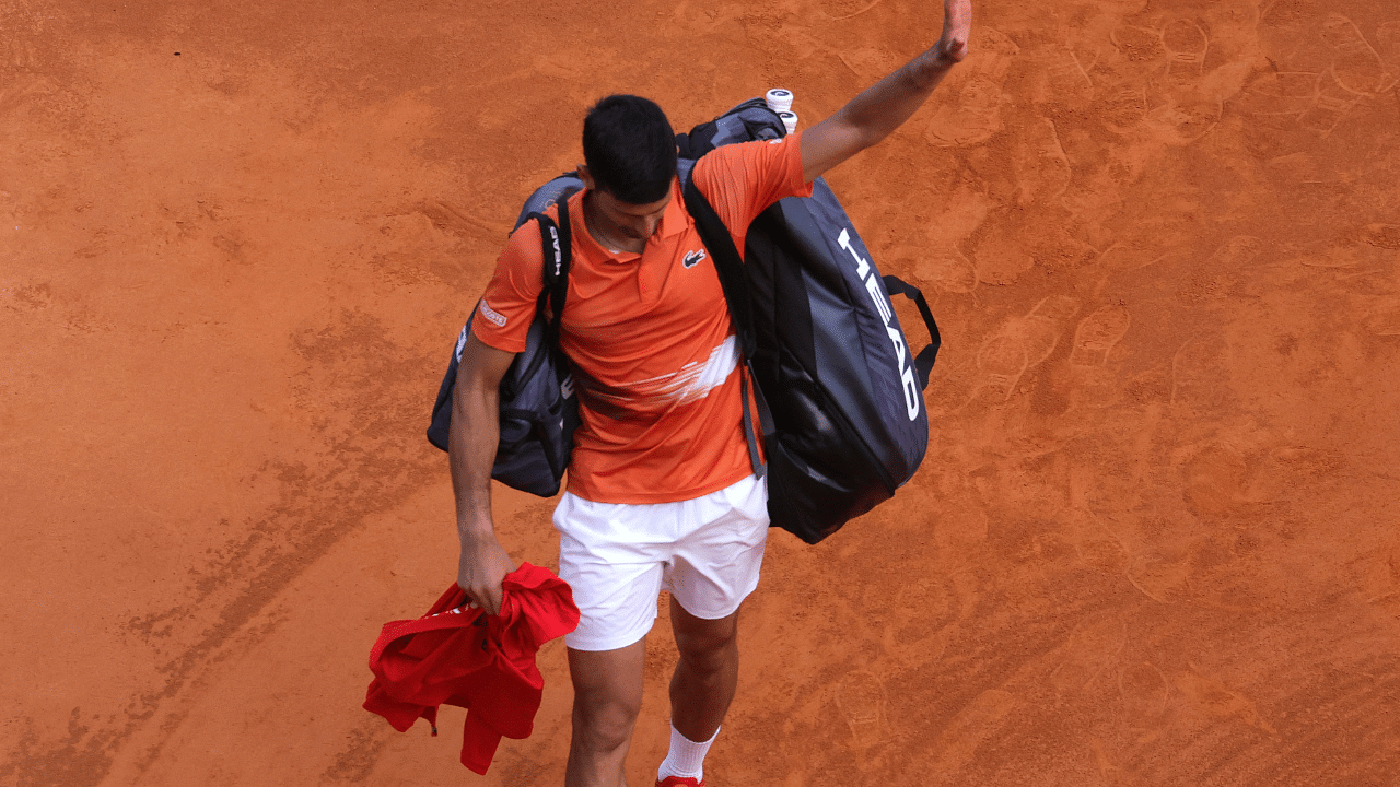 Serbia's Novak Djokovic waves as he leaves the court after losing against Spain's Alejandro Davidovich Fokina during their Monte-Carlo match. Credit: AFP Photo