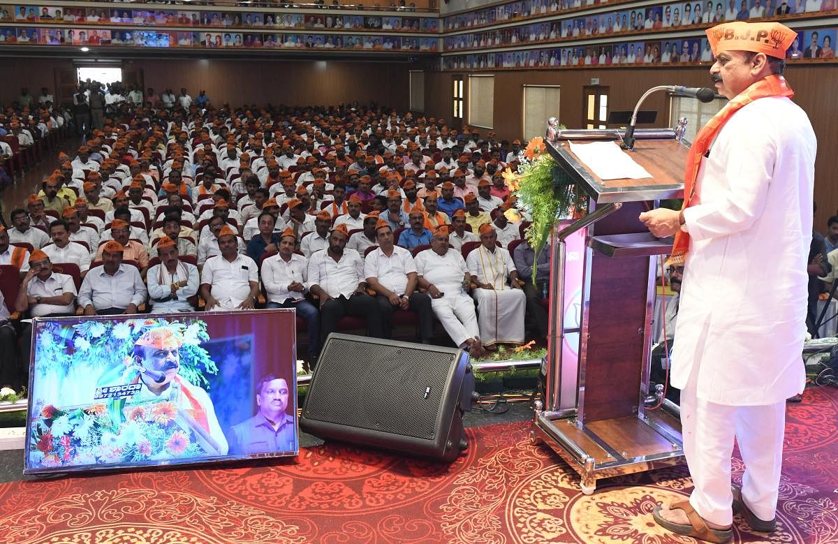 Chief Minister Basavaraja Bommai speaks at a BJP workers' meeting held in Bantwal on Wednesday. DH Photo