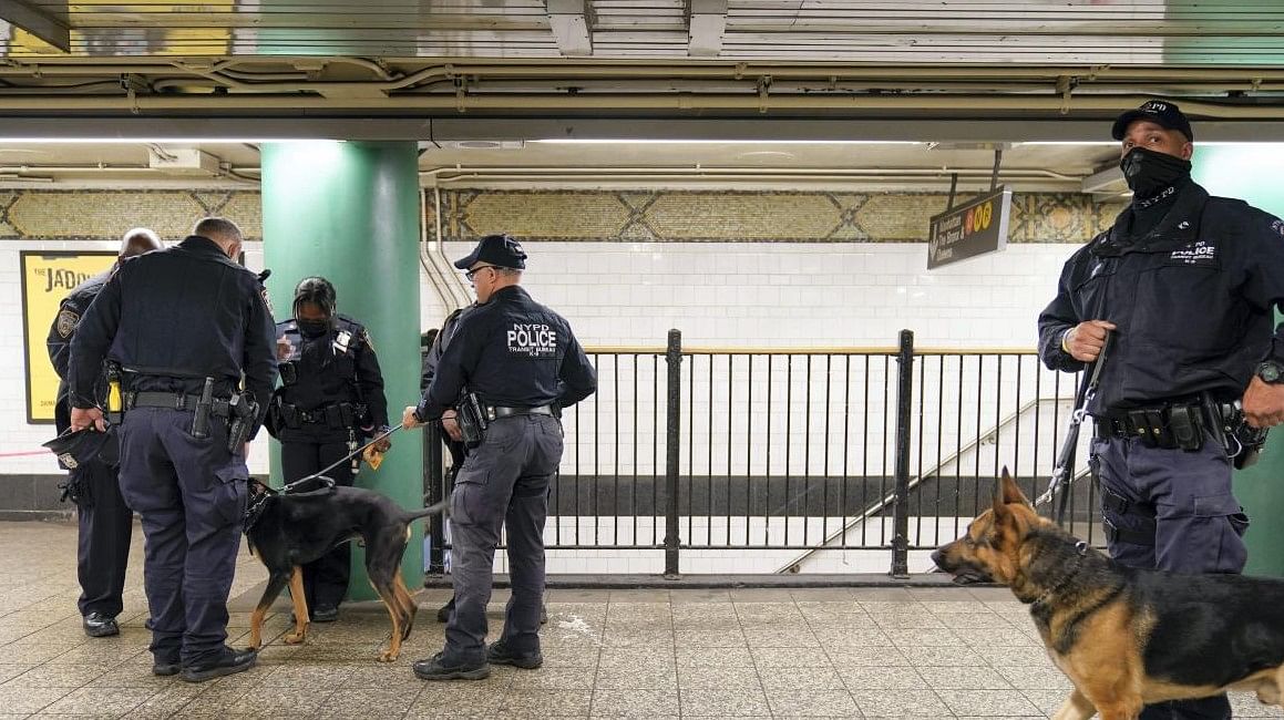 Police officers patrol a subway station in New York, Tuesday, April 12, 2022. Multiple people were shot and injured Tuesday at a subway station in New York City during a morning rush hour attack that left wounded commuters bleeding on a train platform. Credit: AP