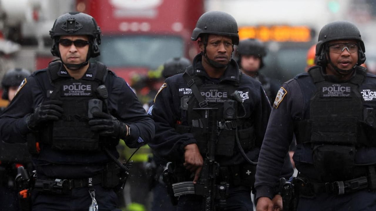 Police officers work near the scene of a shooting at a subway station in the Brooklyn borough of New York City, New York, U.S., April 12, 2022. Credit: Reuters Photo