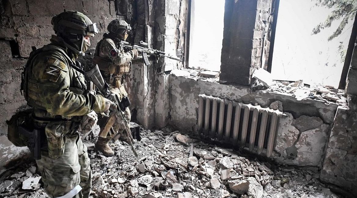 wo Russian soldiers patrol in the Mariupol drama theatre, bombed last March 16, in Mariupol on April 12, 2022, as Russian troops intensify a campaign to take the strategic port city, part of an anticipated massive onslaught across eastern Ukraine. Credit: AFP