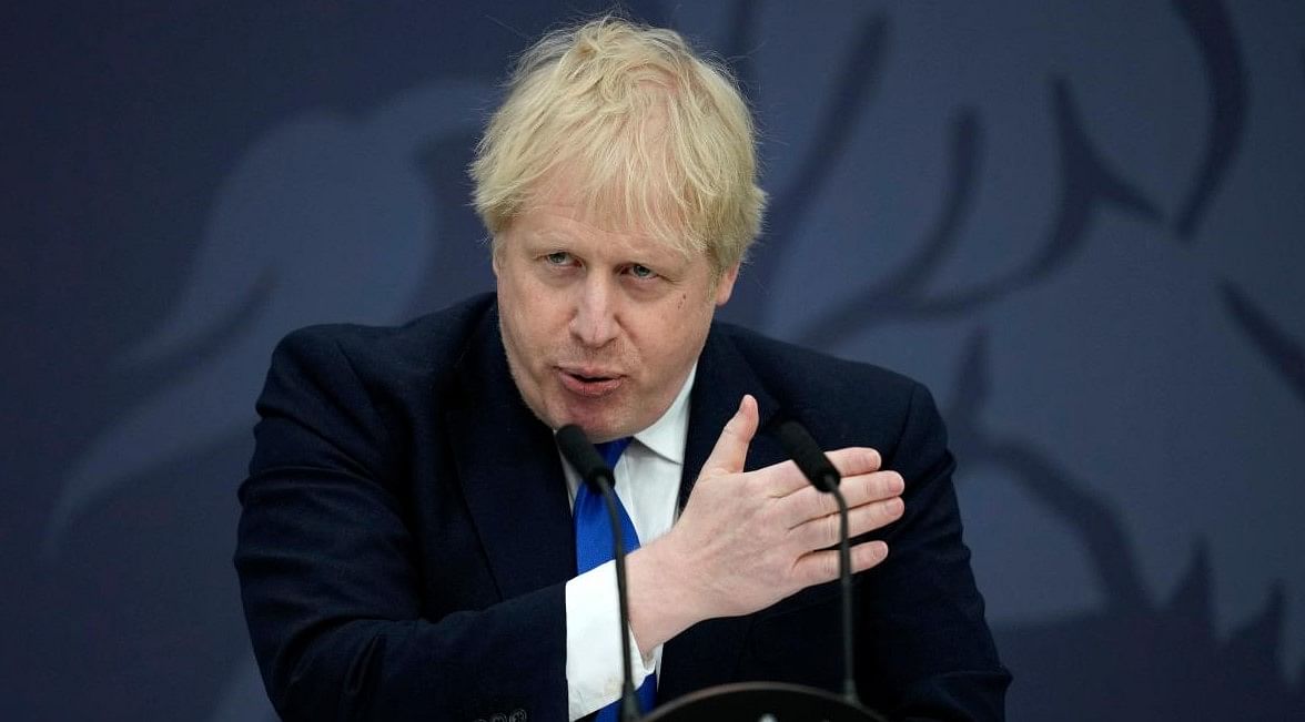Britain's Prime Minister Boris Johnson makes a speech on immigration, at Lydd Airport, in south east England. Credit: AFP