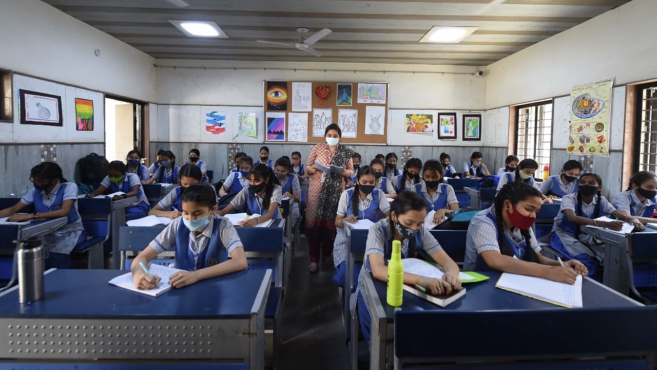 The Directorate of Education (DoE) also said that students and staff must wear masks and maintains social distancing to the extent possible. Credit: PTI File Photo