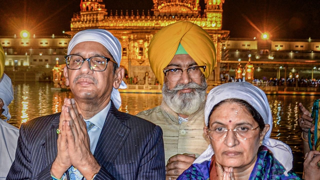Chief Justice of India Justice NV Ramana with his wife Shivamala offers prayer at the Golden temple in Amritsar. Credit: PTI Photo