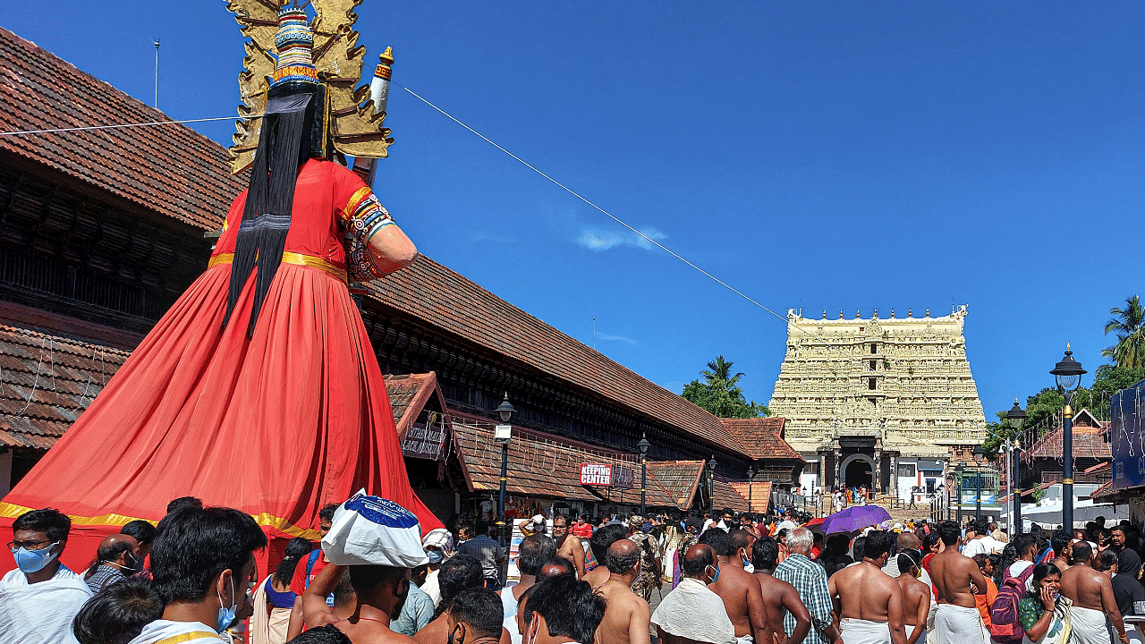 Devotees wait to offer prayers at Sree Padmanabhaswamy temple on the Vishu Day. Credit: PTI Photo