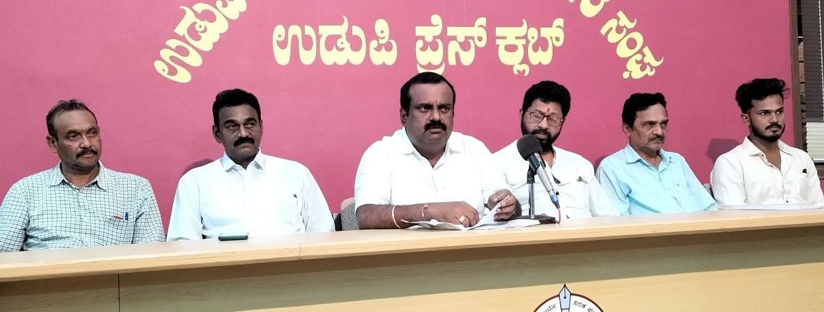 JD(S) district president Yogish V Shetty speaks to reporters in Udupi.